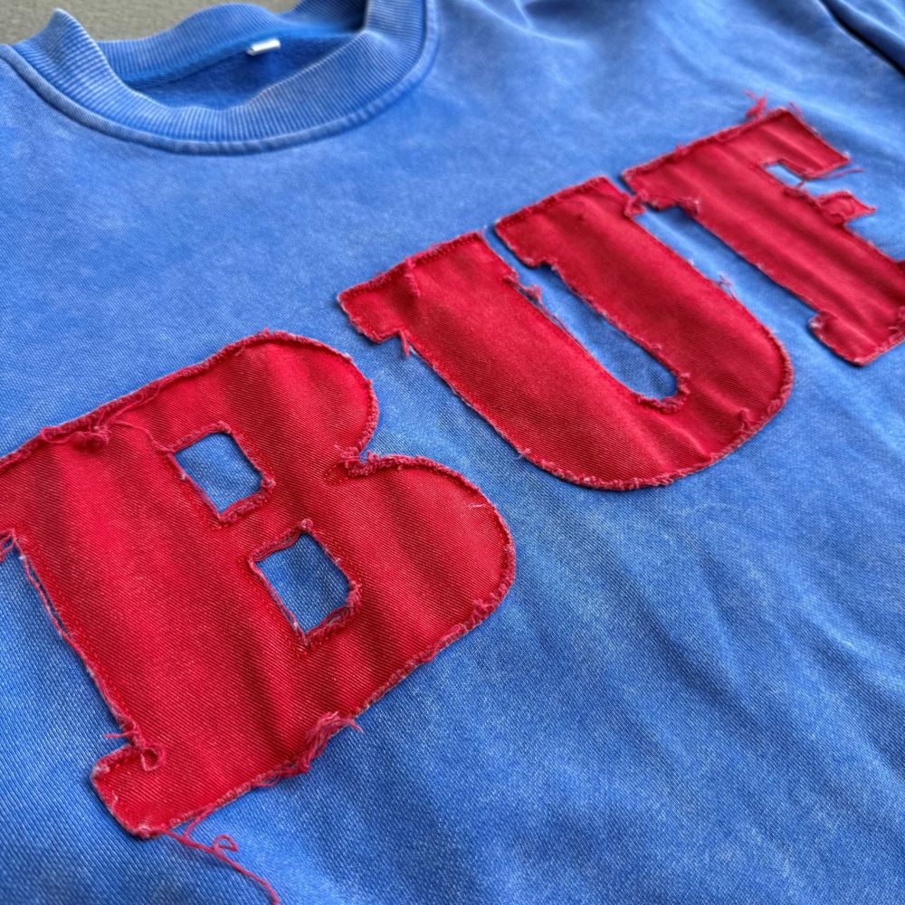 Distressed Embroidery decoration craft on custom apparel by Huaxing Apparel