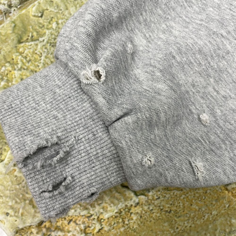 Distressed Holes decoration craft on custom apparel by Huaxing Apparel