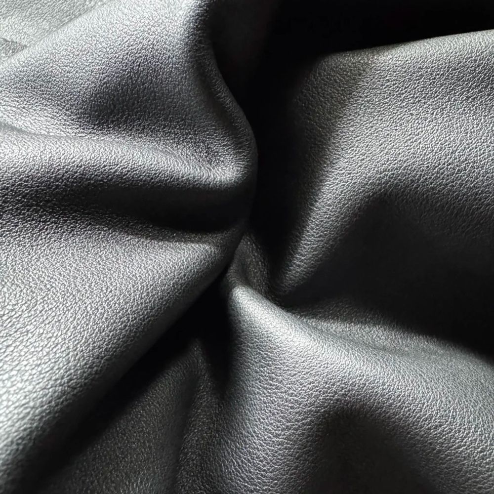 Leather fabric option for custom streetwear production at Huaxing Apparel