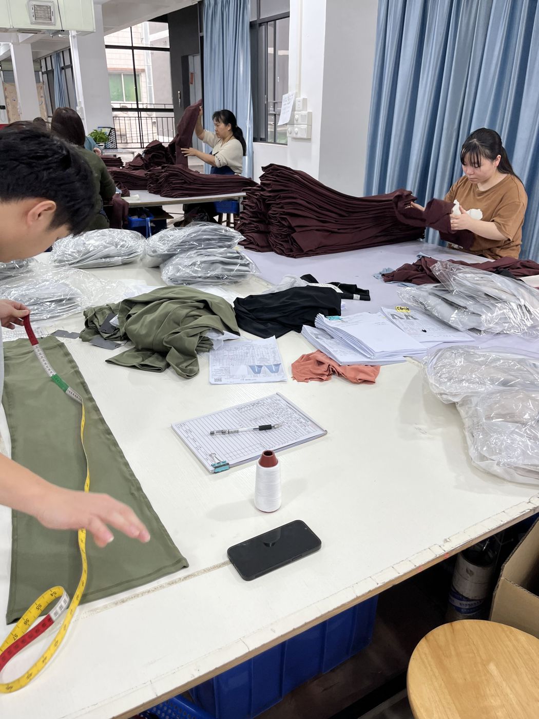 Inspection and packing before shipment at Huaxing Apparel factory in Dongguan, China