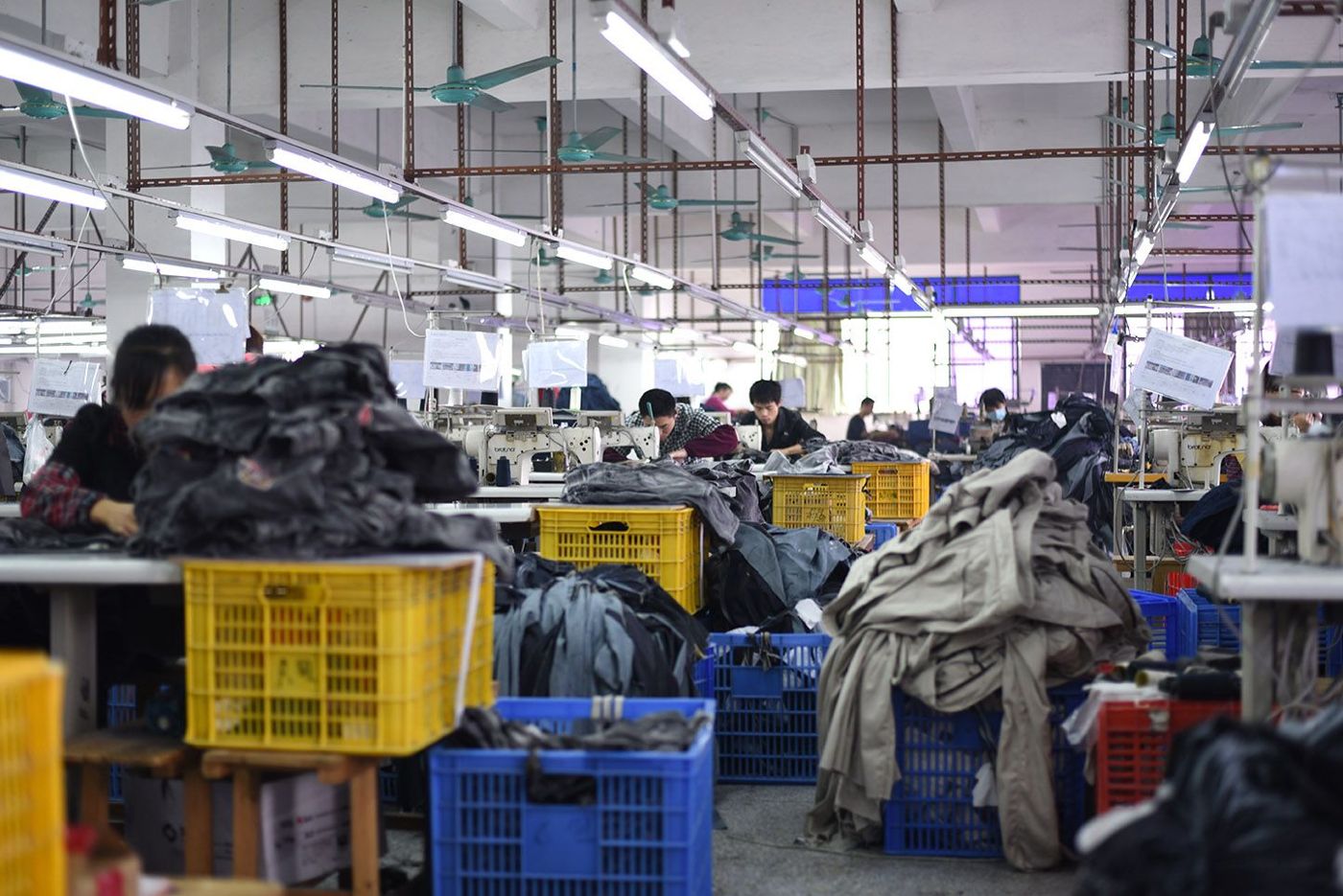 Organized flow between stations at Huaxing Apparel factory in Dongguan, China