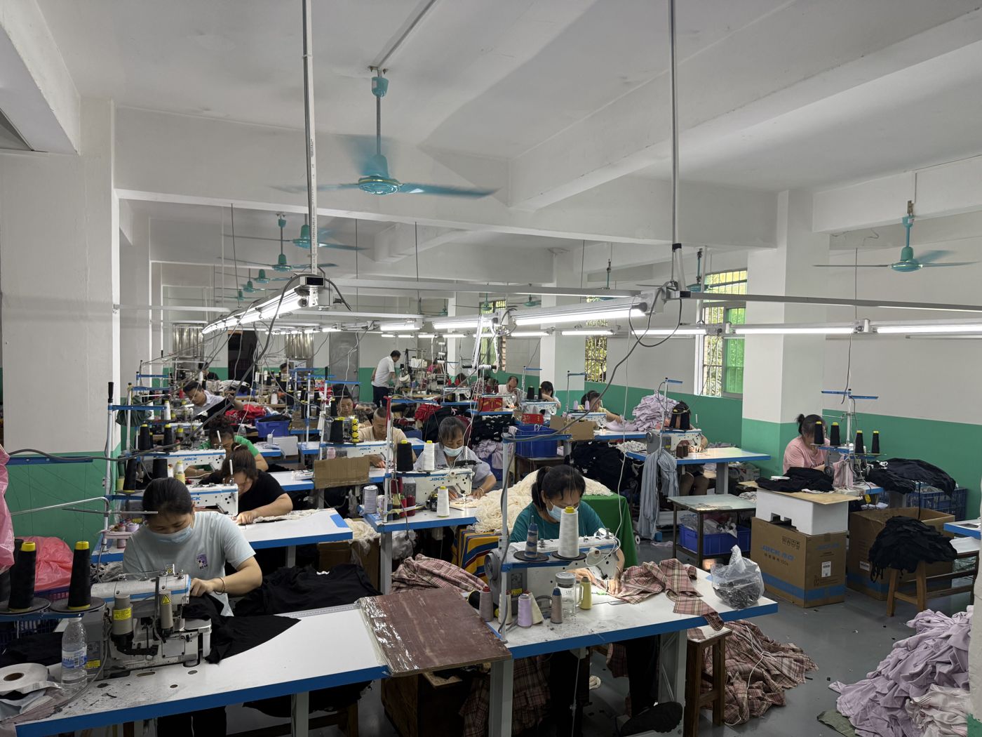 Production lines running daily at Huaxing Apparel factory in Dongguan, China
