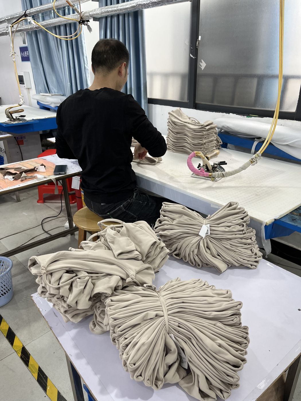 Ribbing and trims prepared per order at Huaxing Apparel factory in Dongguan, China