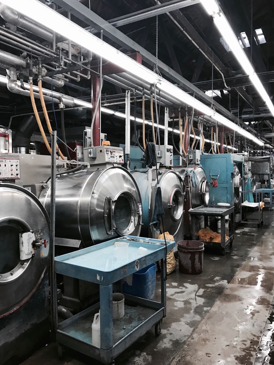 Industrial garment washing machines at the partner wash house used by Huaxing Apparel