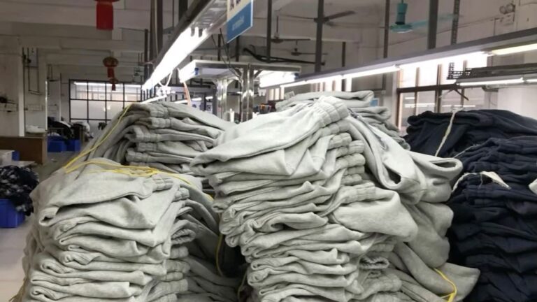 Small-batch custom hoodie production run at Huaxing Apparel factory — low 50-piece MOQ